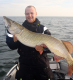 Christian Hedegaard med drømmefisk på næsten 15kg fanget på en 19cm Savage Gear Herring Shad i "sild"